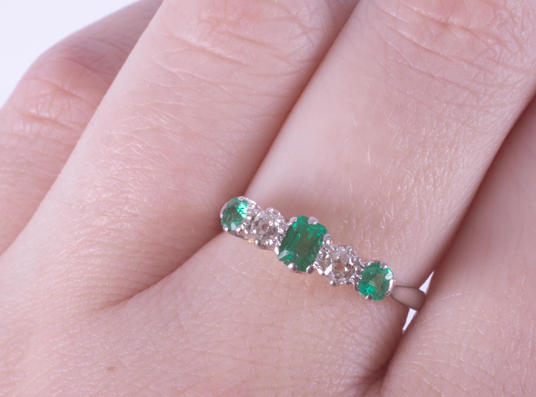 A platinum & 18ct yellow gold five stone ring set with a central emerald cut emerald, - Image 2 of 4