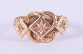 An antique 18ct yellow gold 'keeper' ring set with three small old rough cut diamonds, 4.82gm,