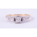 An 18ct yellow gold & platinum ring set with a central cushion shaped diamond, approx. 0.38 carats