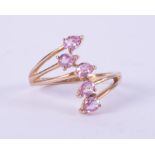 A 9ct yellow gold ring set with five pear shaped pink sapphires, total weight approx. 0.70 carats,