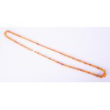 A string of oval shaped amber beads of varying sizes with an amber bead screw clasp, length 52",