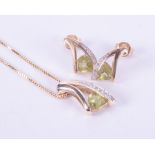 A set comprising of a 9ct yellow & white gold pendant set with a triangular cut peridot, approx. 0.