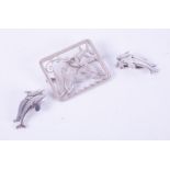 A Georg Jensen set comprising of a pair of silver dolphin clip-on earrings, stamped Georg Jensen,