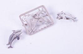 A Georg Jensen set comprising of a pair of silver dolphin clip-on earrings, stamped Georg Jensen,