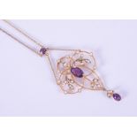 A 9ct yellow gold Art Nouveau design necklace set with two oval cut amethysts measuring 9mm x 5.