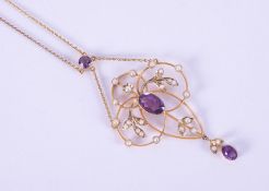 A 9ct yellow gold Art Nouveau design necklace set with two oval cut amethysts measuring 9mm x 5.