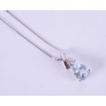 A 9ct white gold pendant set with a pear shaped aquamarine, approx. 1.16 carats with a tiny round