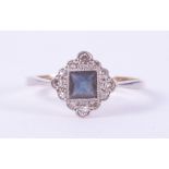 An antique 18ct yellow gold & platinum ring set with a central square cut sapphire, approx. 0.35