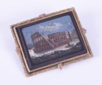 A gilt metal framed 'Grand Tour' micro-mosaic brooch, depicting the Roman Colosseum, measuring