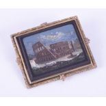 A gilt metal framed 'Grand Tour' micro-mosaic brooch, depicting the Roman Colosseum, measuring