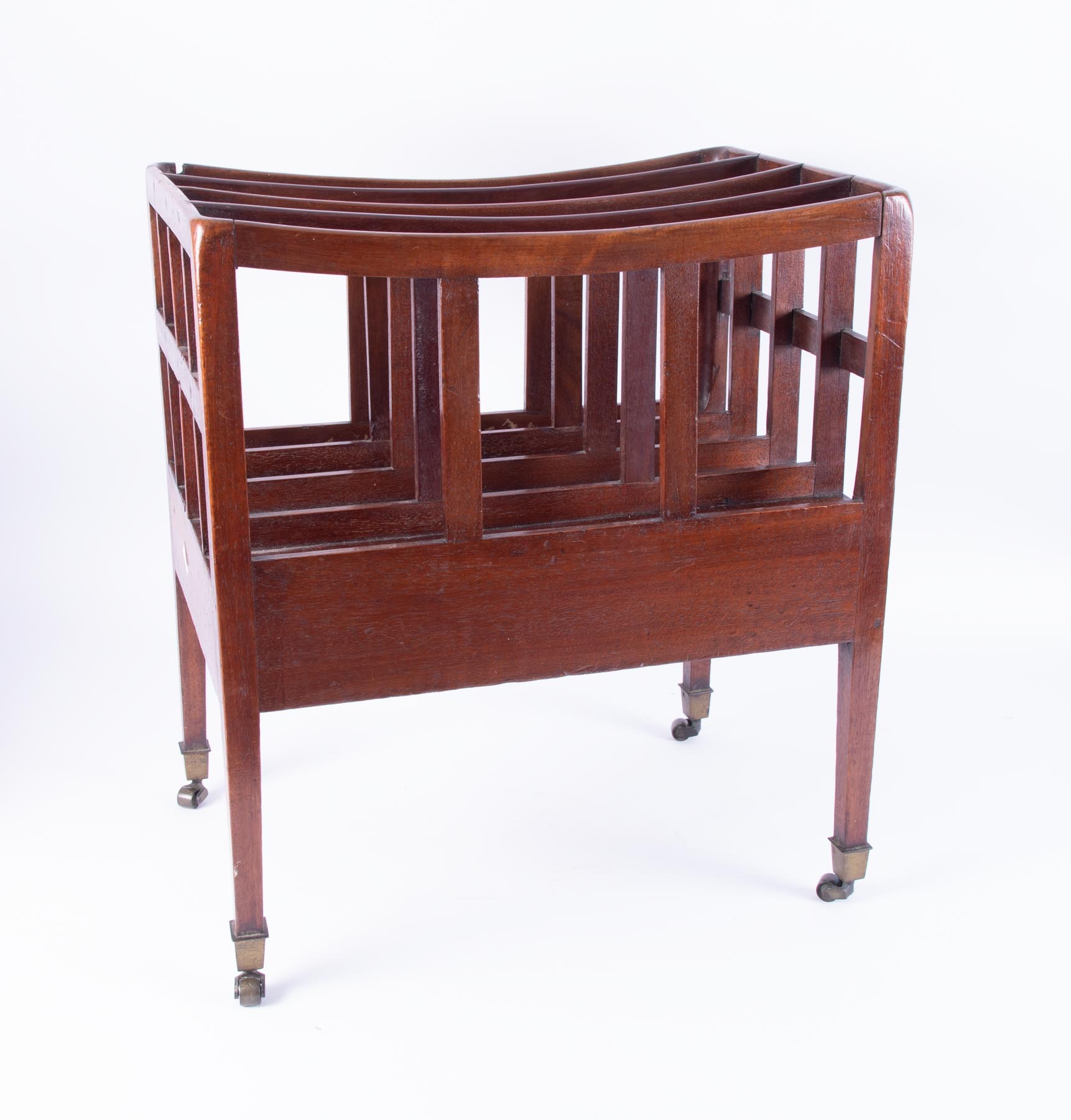 A 19th Century mahogany canterbury with brass castors, height 51cm.