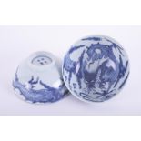 A pair of Chinese blue and white porcelain tea bowls decorated with dragon chasing flaming pearl,