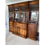 A large reproduction mahogany two section bookcase, glazed upper section, fitted with a fall front