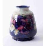 A William Moorcroft vase decorated with purple anemones, height 16cm, fully restored and rebuilt,