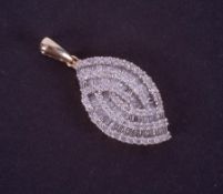 A 9ct yellow & white gold teardrop shaped swirl pendant set with a mixture of baguette cut & round