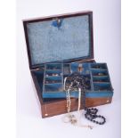 A mahogany jewellery box inlaid with mother of pearl decoration and containing a small quantity of