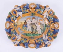 An antique polychrome Majolica plate, diameter 25cm, (the image is based on a marble bas relief by