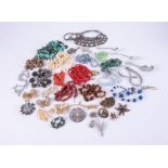 A large selection of costume jewellery items to include bead necklace, brooches, earrings, etc and