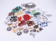 A large selection of costume jewellery items to include bead necklace, brooches, earrings, etc and