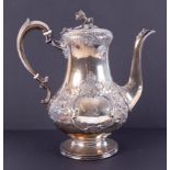 A Victorian silver coffee pot decorated with flowers, flower finial, London hallmark, date 1860-