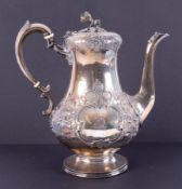 A Victorian silver coffee pot decorated with flowers, flower finial, London hallmark, date 1860-