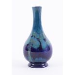 A William Moorcroft blue moonlit blue onion vase, height 16cm (minor restoration to rim).