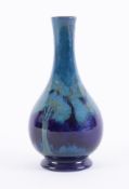A William Moorcroft blue moonlit blue onion vase, height 16cm (minor restoration to rim).