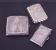 Three silver cigarette cases including a Victorian silver cigarette case, Birmingham hallmark,