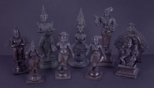 Eight bronze deity figures, tallest 20cm.