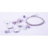 A mixed lot of silver jewellery to include five tanzanite set rings, a tanzanite set bracelet & a