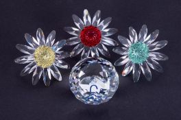 Swarovski Crystal Glass, red, yellow and green daisy and SCS crystal paperweight ball, boxed (4).