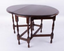 An oak miniature gate leg table, height 36cm.