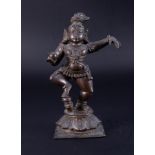 A bronze deity figure, height 17cm.