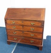 A Georgian mahogany writing bureau fitted with four drawers and brass handles, height 105cm, width