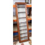 A mahogany 'Apothecaries' cabinet fitted with eight shelves, and single glazed door height 150cm.