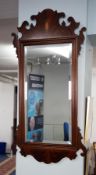 A mahogany 'Chippendale' design wall mirror.
