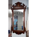 A mahogany 'Chippendale' design wall mirror.