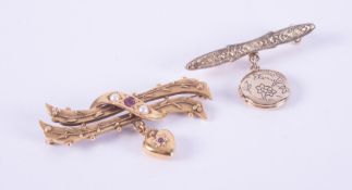 Two bar style brooches to include a 14k yellow gold bar brooch with leaf engraved pattern and a