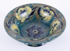 William Moorcroft, Florian ware footed bowl in blue & green circa 1902.