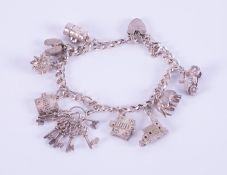 A silver heart padlock charm bracelet with nine silver charms attached including a hedgehog,