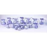 A collection of 19th century blue and white transferware, seventeen Masons Ironstone jugs in various