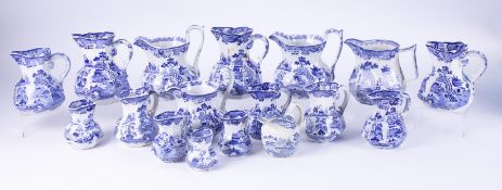 A collection of 19th century blue and white transferware, seventeen Masons Ironstone jugs in various
