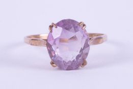 A 9ct yellow gold ring set with an oval amethyst, approx. 4.75 carats, 2.76gm, size T.