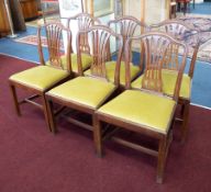 A set of six mahogany Hepplewhite style dining chairs.