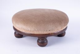 A mahogany small circular foot stool.