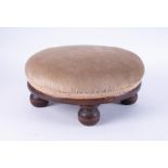 A mahogany small circular foot stool.