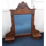 A large late Victorian carved walnut mirror fitted with two drawers, height 119cm.