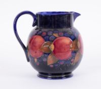 A William Moorcroft large 'Pomegranate' jug, height 20cm.