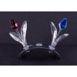 Swarovski Crystal Glass, 'Red Tulip', 'Blue Tulip' and stand, boxed.