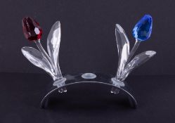 Swarovski Crystal Glass, 'Red Tulip', 'Blue Tulip' and stand, boxed.